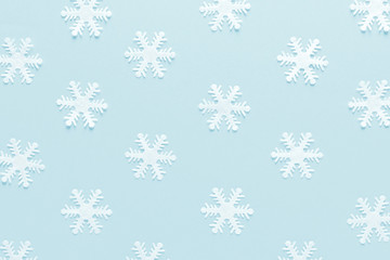 Christmas, New Year or Noel holiday festive winter greeting card with decorations, snowflakes on blue background, flat lay composition, top view