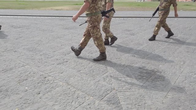 Military Team with weapons walk in a city 4k 60fps