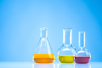 Minzurki for the laboratory. Flasks in a chemical laboratory. Flasks are flat-bottomed.Beakers with different liquids. Chemical substances.Multi-colored mixtures in glass flasks.Laboratory practice
