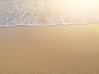 Fototapeta na wymiar white ocean waves on sandy beach