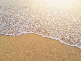 Fototapeta na wymiar white ocean waves on sandy beach