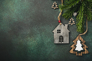 Festive background with toy wooden house christmas tree and decoration. Copy space, winter holidays...