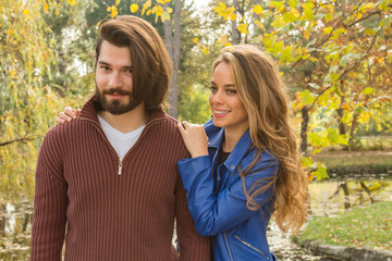 Fototapeta premium Couple in the park enjoying nice autumn time.