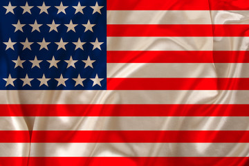 national flag of the USA country on luxurious texture of satin, silk with waves, travel concept, immigration, politics
