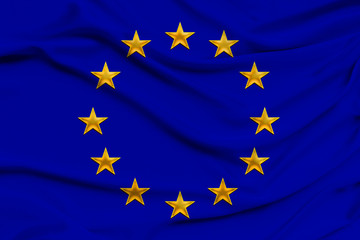 stylized European Union flag, symbol of united Europe on soft silk with soft folds, close-up