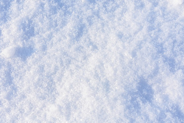 Texture of the white fluffy snow for background