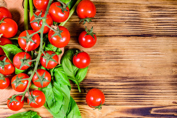 Heap of small cherry tomatoes on wooden table. Top view