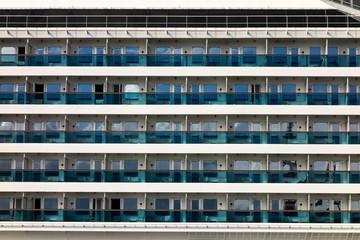 Windows and balconues on an ocean luxury cruise ship as an abstract background