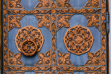Closeup of the old door with fancy pattern