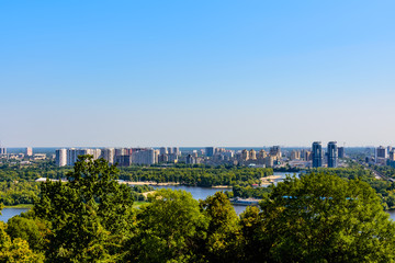 Fototapeta na wymiar View on residential districts on left bank of the river Dnieper in Kiev, Ukraine