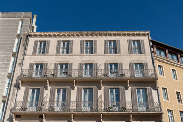 Fototapeta na wymiar large ancient building facade typical of Avignon city center