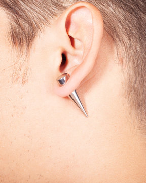 ear piercing tunnel extension  close up