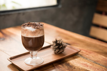 selective focus close up home made hot chocolate .Wood table top with chocolate in cafe  or (coffee shop,restaurant ) Selective focus background