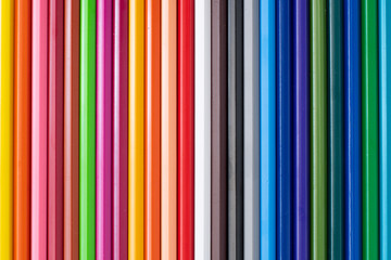Colored Pencils as background. Multicolored texture. Top view