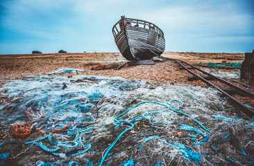 old abandoned boat on the beach in Dungeness UK