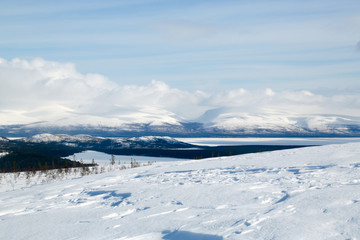 Fototapeta na wymiar winter mountain landscape with mountains and blue sky