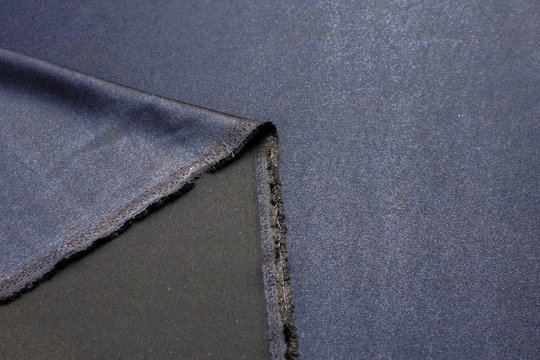 Texture, background, pattern. Black Rayon Fabric for tailoring.