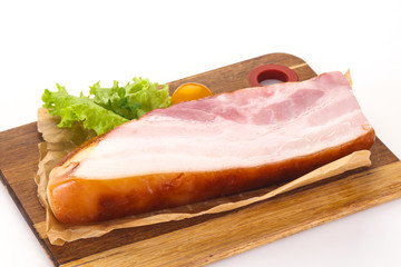 Smoked pork breast with salad leaves