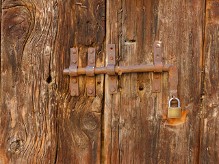 old wooden door on the wall of an italian house