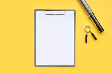 empty paper and accessory on yellow background
