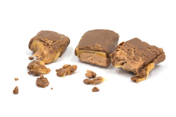 Chocolate caramel broken isolated on white background.
