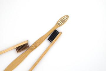 Wooden bamboo toothbrushes isolated on white background. Concept dental eco-friendly...