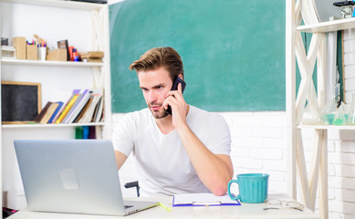 man make note and drink coffee. student man in classroom with tea cup. modern education. college life. school teacher use computer and phone. back to school. Working day morning. search engine