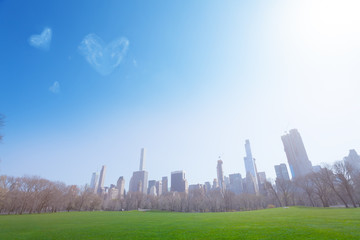 Fototapeta na wymiar Heart love shape clouds over New York panorama