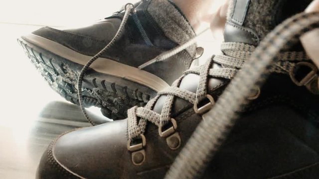 Closeup Of Black Woman Hands Lacing Her Hiking Shoes