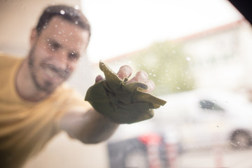 Man polishing his car.