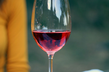 Wineglass with rose wine inside. Copy Space for Text.