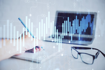 Multi exposure of man hands with stock market forex graph.