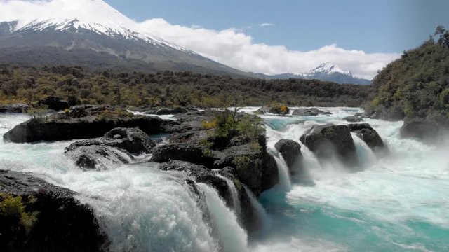 Forest, rapids and volcano Osorno, Patagonia landscape of Saltos de Petrohue, the region of Los Lagos, Chile. 4k