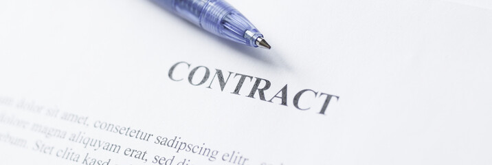 Pen lying on a contract or application form
