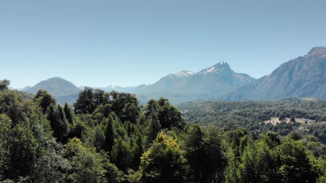 Aerial view of the horizon of the lake movement from the forest of the coihue trees to the amazong lake Nahuel Huapi, patagonia, Argentina. 4k