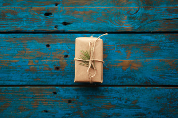Christmas present on blue wooden table
