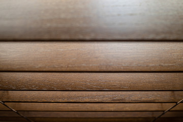 Polished wooden roman blinds with wood grain