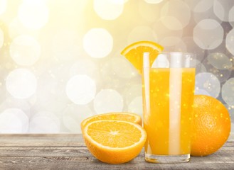 Naklejka premium Orange Juice in glass on background.