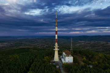 Tv tower on the hill at sunset