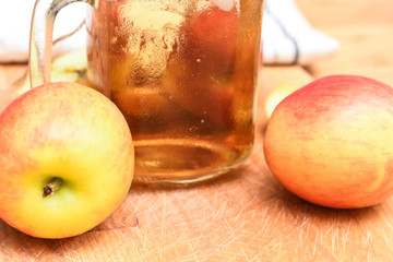 Apple juice freshly made in home kitchen with healthy chopped apples on the table