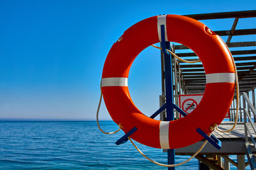 Buoy on the beach. Safety equipment. Safety on the water. Safeguard.    