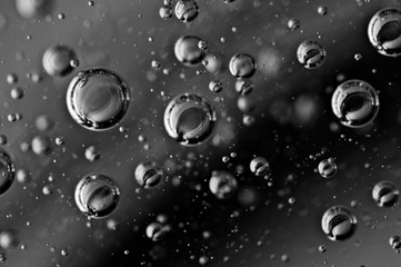 The movement of air in the water. Macro. Black and white. For eco concepts or drinks, liquids with bubbles, abstract backgrounds.