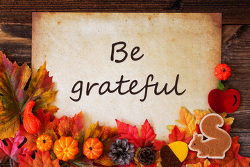 Old Paper With English Text Be Grateful. Colorful Autumn Decoration Like Leaves and Pumpkin