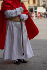 Penitent holding a cross in a procession