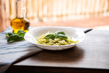 italian pasta with pesto, potatoes, grana padano, olive oil. Basil sauce. 
