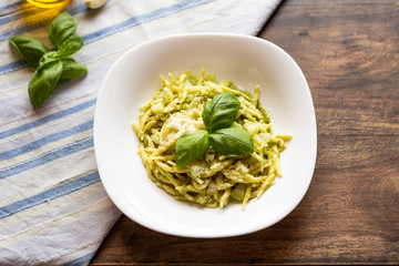 italian pasta with pesto, potatoes, grana padano, olive oil. Basil sauce. View from the top