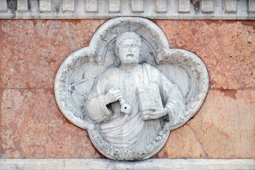 Saint Peter by Giovanni di Riguzzo relief on facade of the San Petronio Basilica in Bologna, Italy