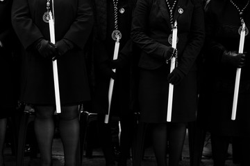 Seated "manolas" holding candles, Holy Week