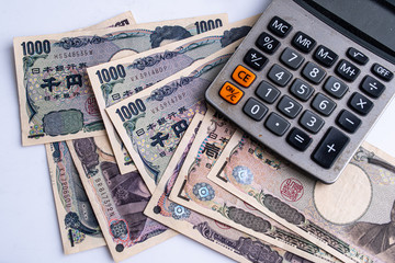 Japanese banknote on Reports and Calculators  Work and profit