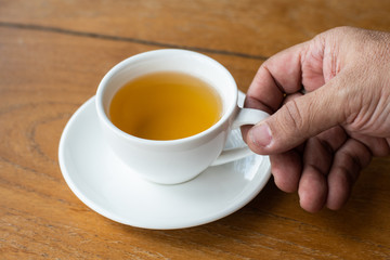 Hot tea cup on wood table